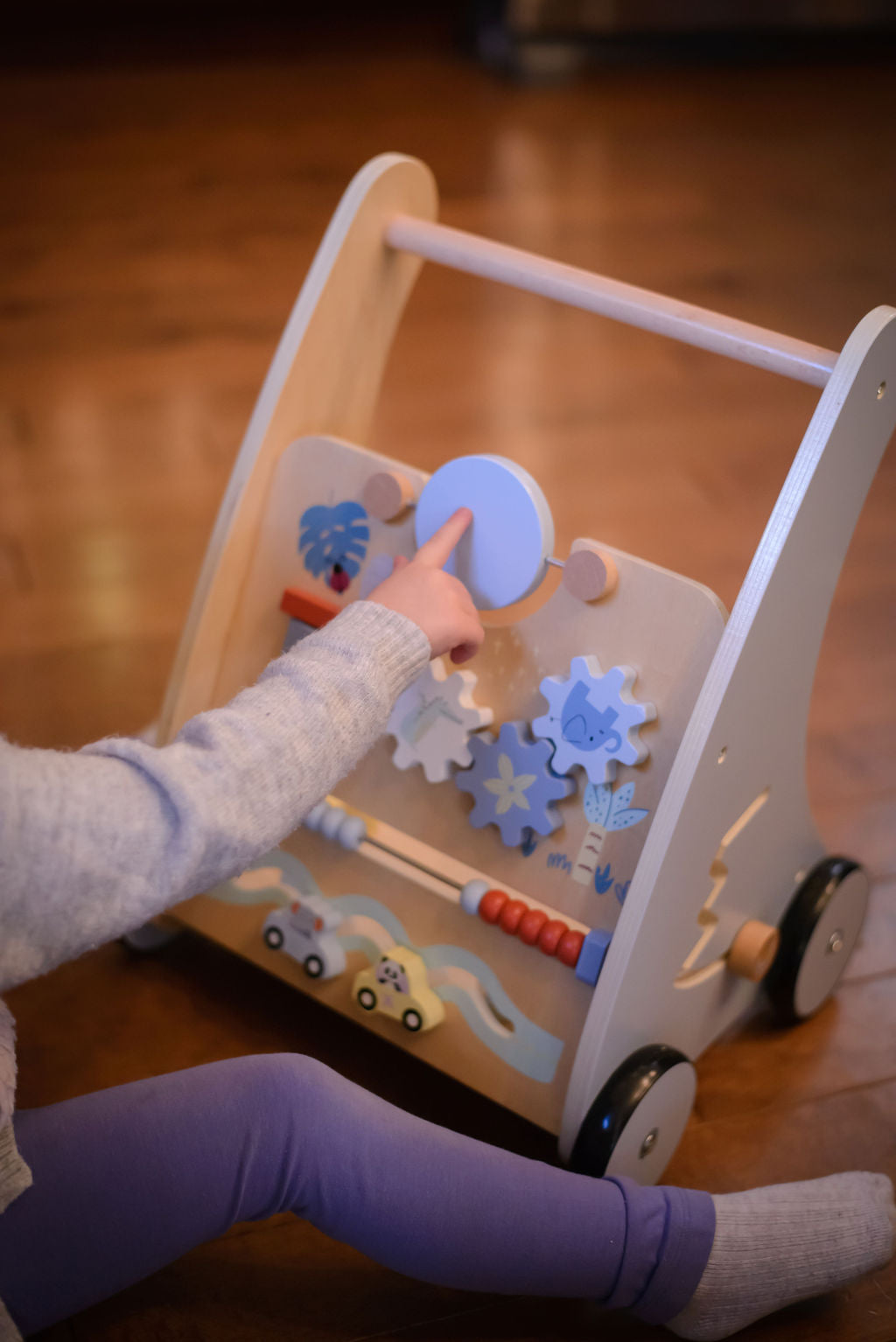 baby playing with a busy board