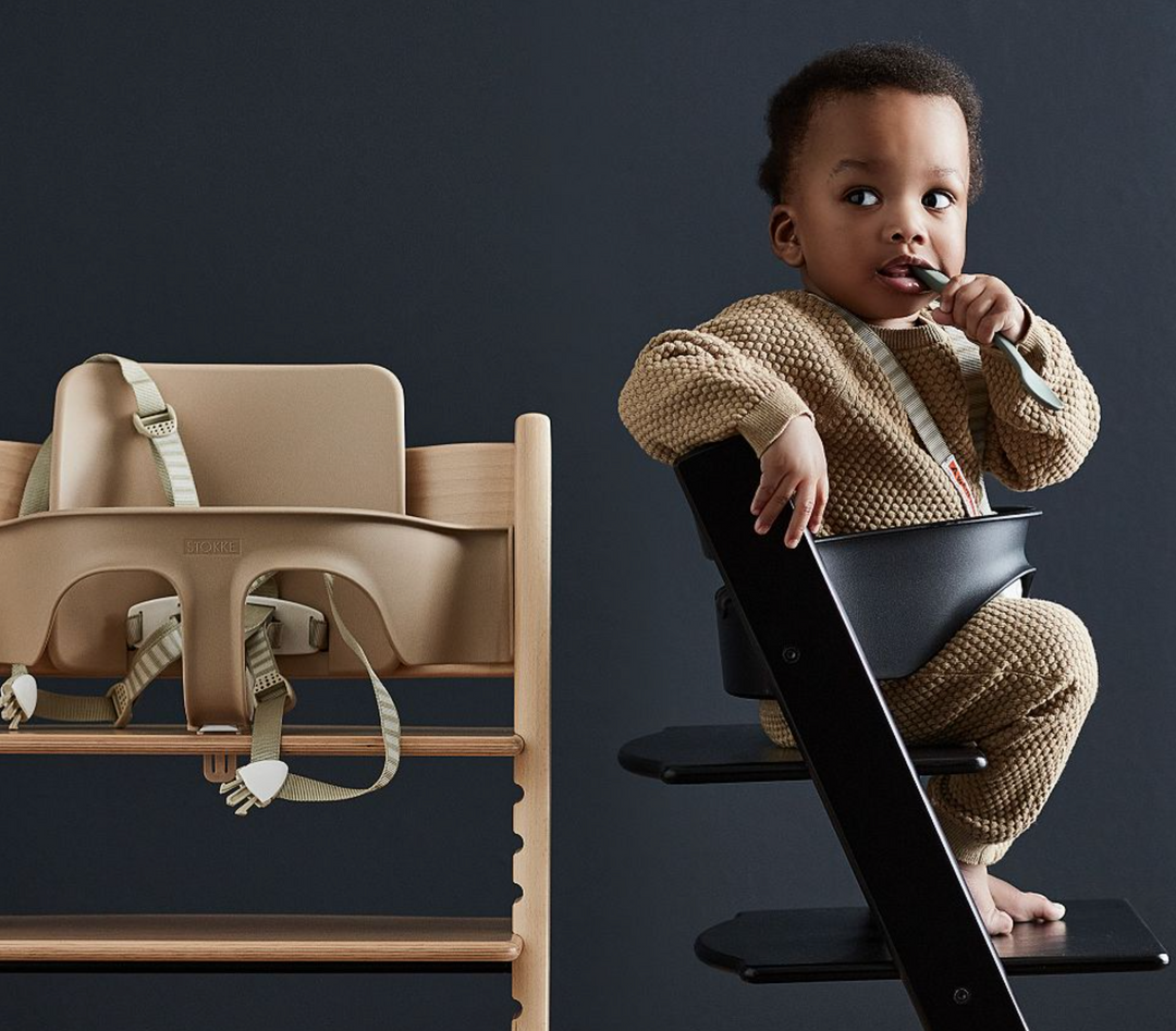 baby on a wooden high chair