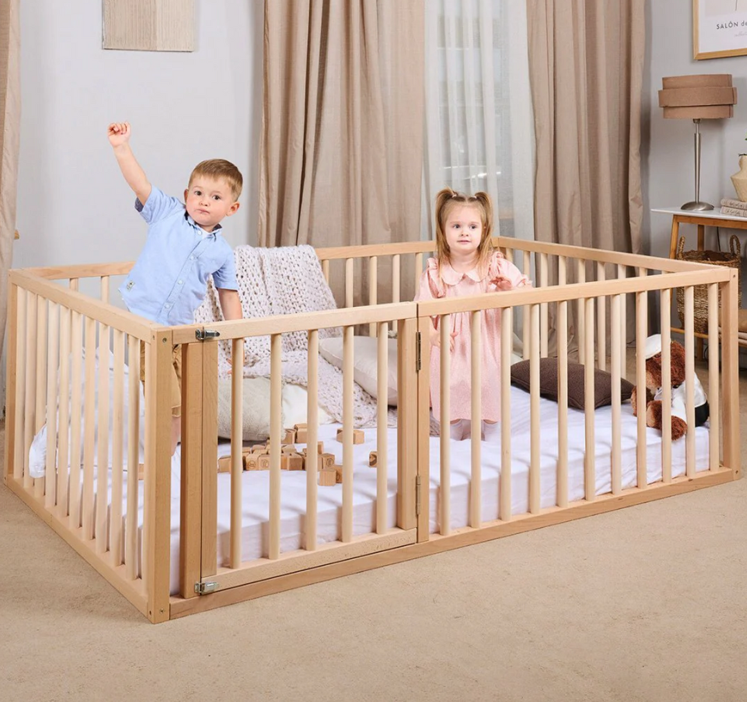 two kids playing on a wooden montessori floor